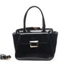 Professional Look Outdoor Scene Brangio Sleek Metallic Handbag