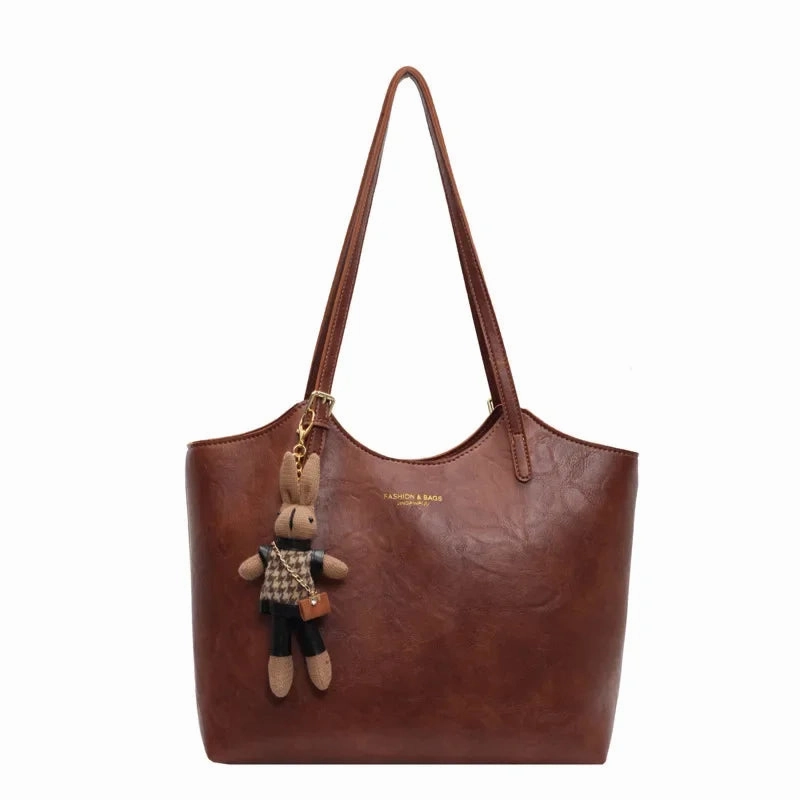 Thalessa | Chic Leather Tote Bag with Playful Charm ?C Elegance Meets Fun Urban Traveler