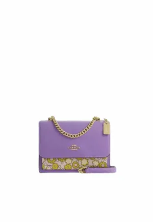 Compact Performance Designed to keep your belongings secure and easily accessible Coach Mini Klare Crossbody Bag Colorblock With Floral Print In Lilac Multi CBM62