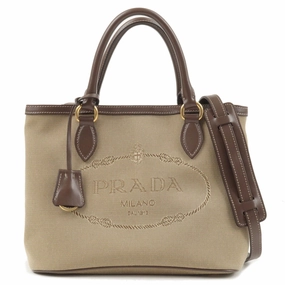Modern Twist Efficiently designed for those who appreciate simplicity and organization Prada Logo Jacquard Beige Canvas Leather Trim Crossbody Satchel Bag