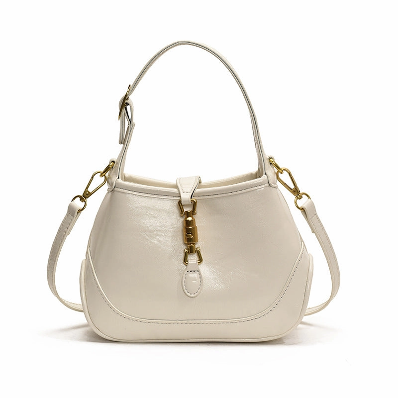 Casual Gear Functional and stylish for anyone on the go Sofie Saddle Bag ?C Glossy Burgundy Vegan Leather Shoulder Bag